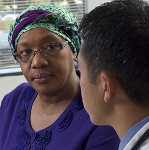 Woman talking to healthcare provider.